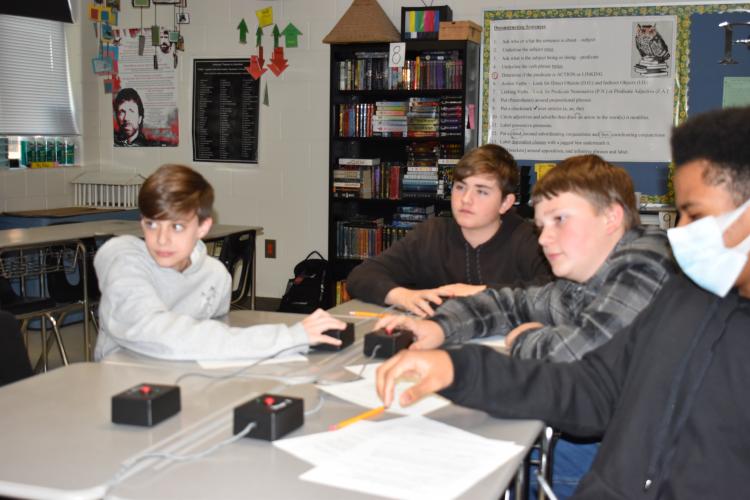 Ashby Booth (from left), James Beach-Colton, Ledger Coley and Kayden Watkins, members of the Oglethorpe County Middle School academic bowl team, practice for the state championship, which is scheduled for Saturday. (Photo/Thomas Ehlers)