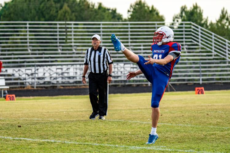 OCHS kicker Joseph Turner punts the ball to Chestatee during the first half. From the tee, Turner recorded two field goals and two extra points during the game. (Photo/Jack Casey)