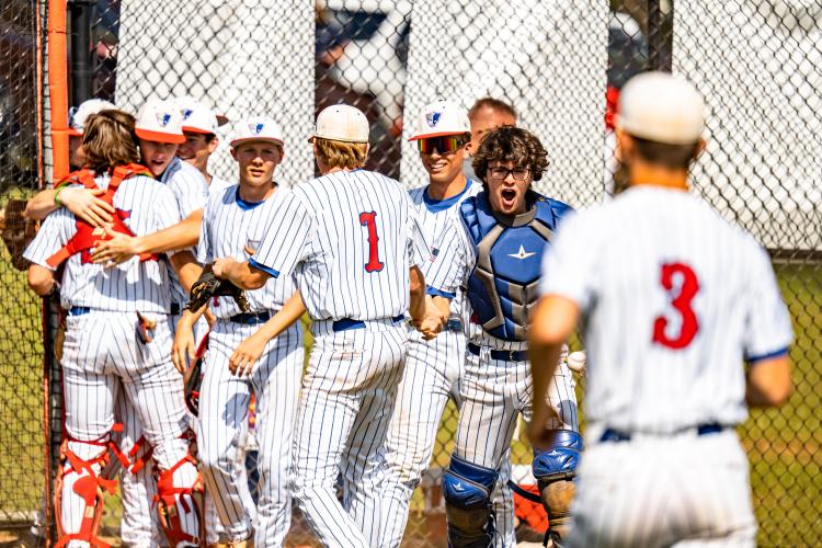 OCHS players celebrate after not allowing a run in the first inning of the first game against Toombs County in the first round of the state playoffs. (Photo/Jack Casey)