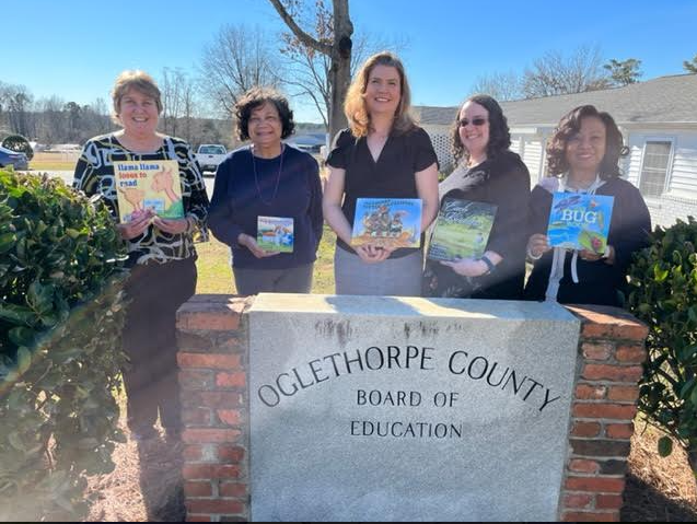 Superintendent Beverley Levine (from left), Gamma Tau member Linda Banks, science instructional coach Jennifer Yauck, English-Language arts department head Elaine Kitchens and assistant superintendent Kanya Cornish celebrate the progress of Dolly Parton’s Imagination Library. (Submitted Photo)