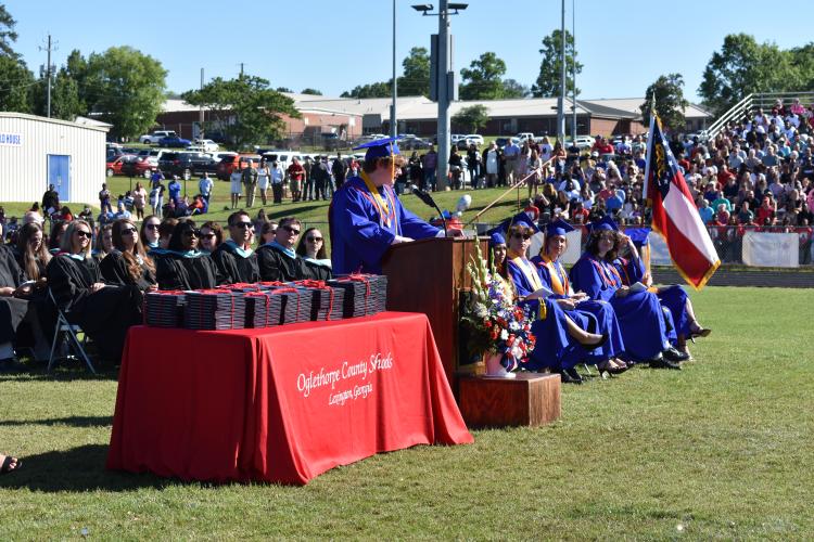 OCHS salutatorian Myles Oliver delivers his graduation speech, titled “Never Gonna Let You Down.” Oliver expressed the importance of individuality and following the path that brings the most joy. (Photo/Sarah Evans)