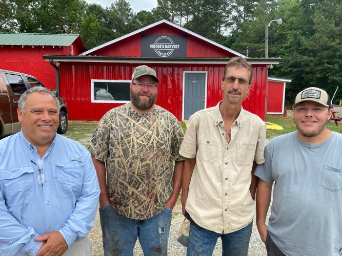 Don Uldrich (from left), Luke Barger, Todd Smith and Tracy Anderson have turned Nature’s Harvest Meat Company into a full-service butcher. Uldrich and Smith are the co-owners, and Barger and Anderson are the butchers. (Dink Nesmith/The Oglethorpe Echo)