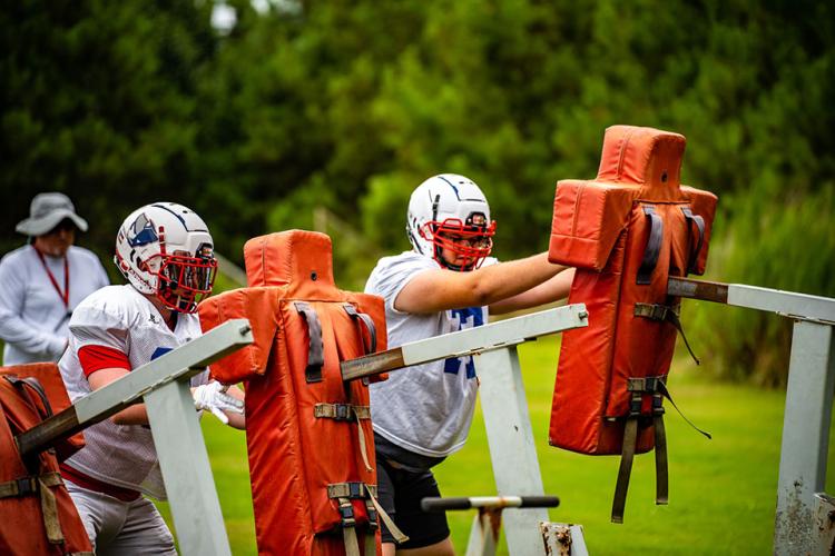 Linemen hit the sleds during the OCHS football team’s first week in pads. The Patriots have had a busy summer, including a FCA camp and 7-on-7 camps. (Photo/Jack Casey)