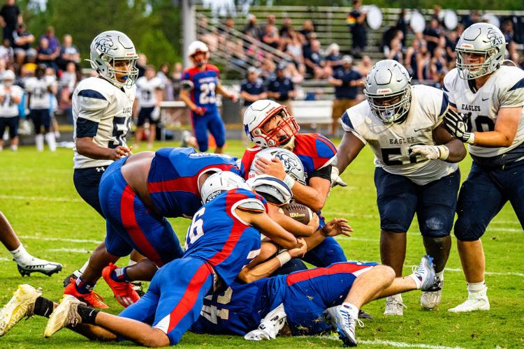 A host of Oglethorpe County tacklers stop an East Jackson runner in the Patriots’ 16-7 victory on Friday. (Photo/Jack Casey)