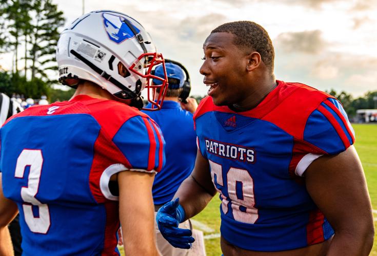 Quarterback Will Sampson, left, and lineman K.B. Bonds get fired up before Oglethorpe County’s season-opening 16-7 victory over East Jackson. The Patriots are 1-0 for the first time since 2011. (Jack Casey/ The Oglethorpe Echo)
