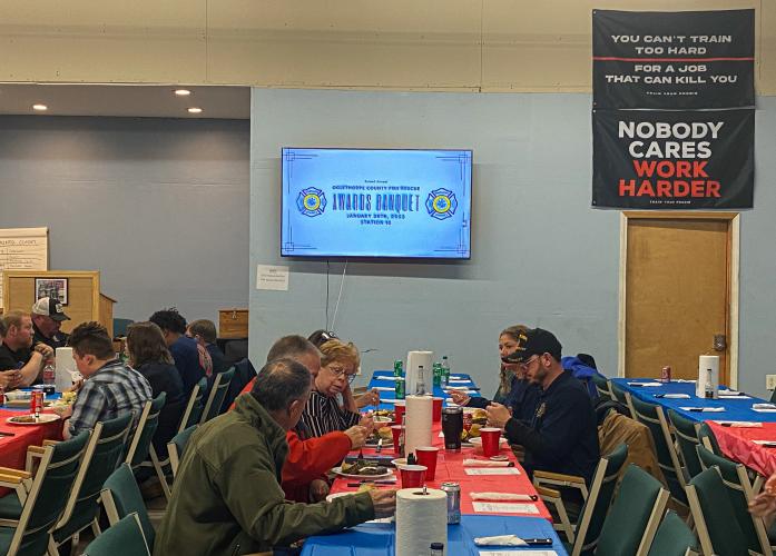 First-responders and their families sit together and chat over their dinners on Saturday. With their busy schedules, the banquet is an opportunity for the responders to spend time with their families. (Photo/Brooke Stewart)