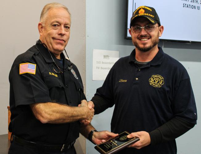 Chief Rocky Miller (left) gives a Firefighter of the Year award to Jim Pierce of Devil's Pond Station on Saturday. Pierce is also a Station Training Officer. (Submitted photo/Cody Gibbs)