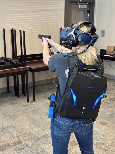 Courtney Corbin, who works with the Oglethorpe County Sheriff’s Office, trains with a virtual reality simulator, which the department received last month. The simulator helps deputies prepare for a variety of scenarios. (Submitted Photo/The Oglethorpe Echo)