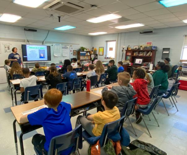 About 20 fifth-grade students at Oglethorpe County Elementary School pay attention to Sgt. Samantha Mathe of the Sheriff’s Office as she teaches about drug prevention as part of the  C.H.A.M.P.S. program. (Brooke Stewart/Photo)