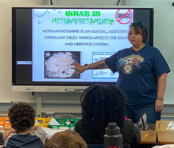 Sgt. Samantha Mathe with the Oglethorpe County Sheriff’s Office teaches students about illegal substances and safety through the C.H.A.M.P.S. program at the Oglethorpe County Elementary School. Last month she spoke with them about the drug, methamphetamine. (Brooke Stewart/Photo)